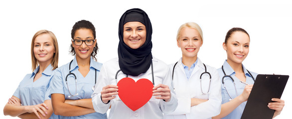 Wall Mural - group of doctors with red heart and clipboard