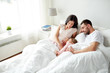 © Syda Productions - happy family in bed at home