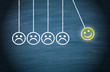 Motivation, Teamwork, Leadership and Coaching Concept - Smiley pendulum on blue background