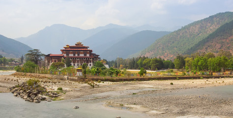 Bhutan panorama landscape. Punakha Dzong, famous buddhist monastery and fortress of traditional style in the valley between two rivers in Bhutan, Himalaya mountains, Asia.