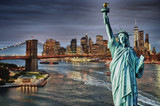 Fototapeta Miasta - Manhattah skyline with Brooklyn Bridge at night and Statue of Liberty.