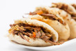 Colombian arepa filled with shredded beef