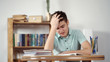 © andy_di - Upset schoolboy doing homework