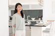 © taka - portrait of attractive asian woman in the kitchen