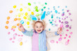 © famveldman - Child on Easter egg hunt. Pastel rainbow eggs.