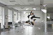 © Sergey Nivens - Dancing businesswoman in office . Mixed media