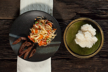 papaya salad with rice stick and grill pork