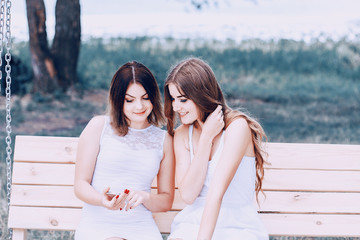 Sticker - two girls resting on the beach