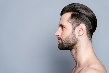 Wall Mural - Side view of handsome young bearded man after bath