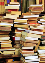 Piles Of Old Books For Sale In A Library