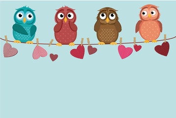 Four cute colored owlet sitting on a string. A red hearts with a picture hanging on a rope.  Valentine's Day. Vector illustration. Greeting card with empty space for the label or advertising.