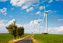 Modern Windmills Along The Road In Countryside