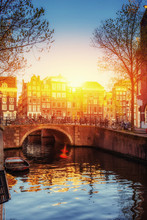 Amsterdam Canal At Sunset.  Is The Capital And Most Pop