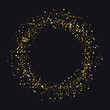 Circle of gold dust with lot of small particles different scale on black background.