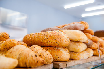 Wall Mural - Various kinds of bread on display in bakery shop. Selective focus