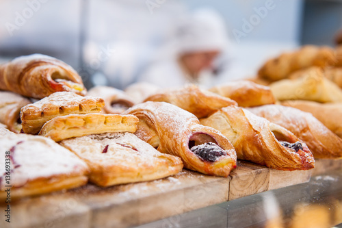 Fotografie, Obraz Close up freshly baked pastry goods on display in bakery shop