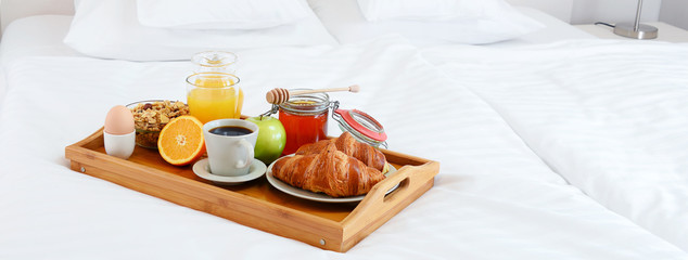 Wall Mural - Breakfast in bed in hotel room.