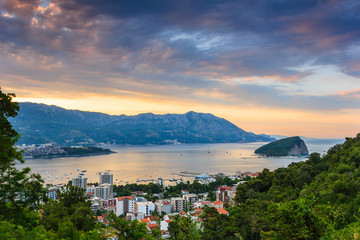 Wall Mural - Panoramic landscape of Budva riviera in Montenegro. Dramatic morning light. Balkans, Adriatic sea, Europe. View from the top of the mountain. 
