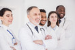 © Yakobchuk Olena - Cheerful team of doctors standing together