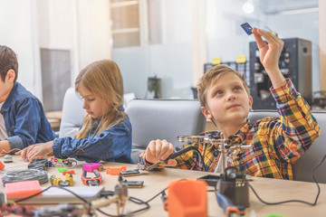 Busy children in light workshop