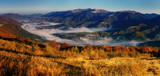 Fototapeta Niebo - View of misty fog mountains in autumn, Carpathians, Ukraine.