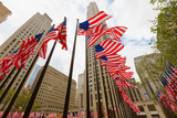 Fototapeta  - US national flags skyscrapers