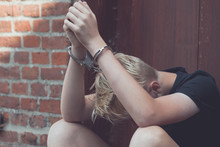 Dejected Teenage Boy Held Captive In Handcuffs