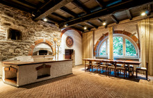 Interior Of An Old Tavern With Old Pizza Oven.