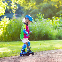 Wall Mural - Kids roller skating in summer park