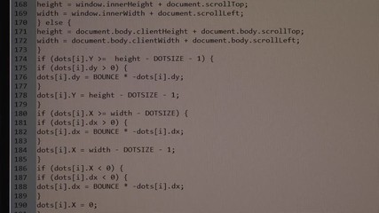 Fototapete - The process of writing a computer program on a computer screen. Text is entered and quickly moved up. A large number of rows of symbols.