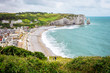 Fantastic white sand beach and cliffs of Etretat, norman french town outdoor landscape. View above the town and the bay of Falaise d'Amont Etretat City, famous landmark of Normandy in France, Europe