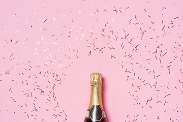 flat lay of celebration. champagne bottle with colorful party st