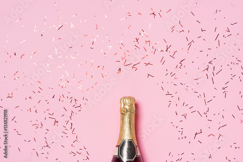Fotografía Flat lay of Celebration. Champagne bottle with colorful party st