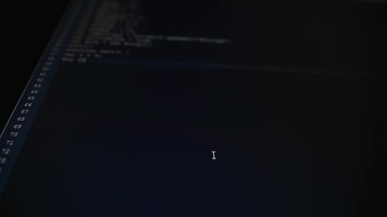 Fototapete - Computer class. On the computer works are carried out. On the monitor there is a process of introduction of a code. The program code is a mere verbiage and programming language symbols.