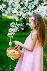 Wall Mural - Little girl playing with Easter eggs