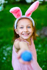 Wall Mural - Little girl with Easter eggs