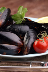 boiled mussels with parsley and tomato - healthy eating concept