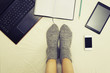 © grufnar - female legs wearing surrounded by multiple communication devices