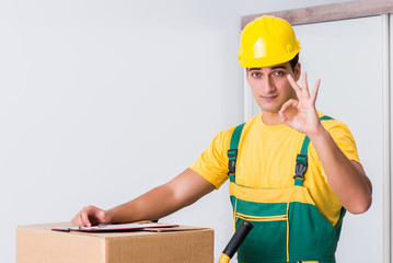 Transportation worker delivering boxes to house