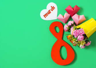 figure 8 and bouquet of flowers in a bucket. International Women's Day. March 8, Happy Women's Day greeting message text