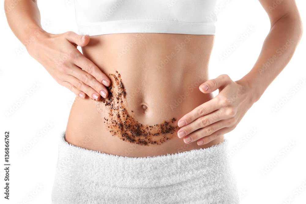 Young woman applying natural scrub on body, closeup