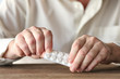 © Africa Studio - Senior man hands with pills