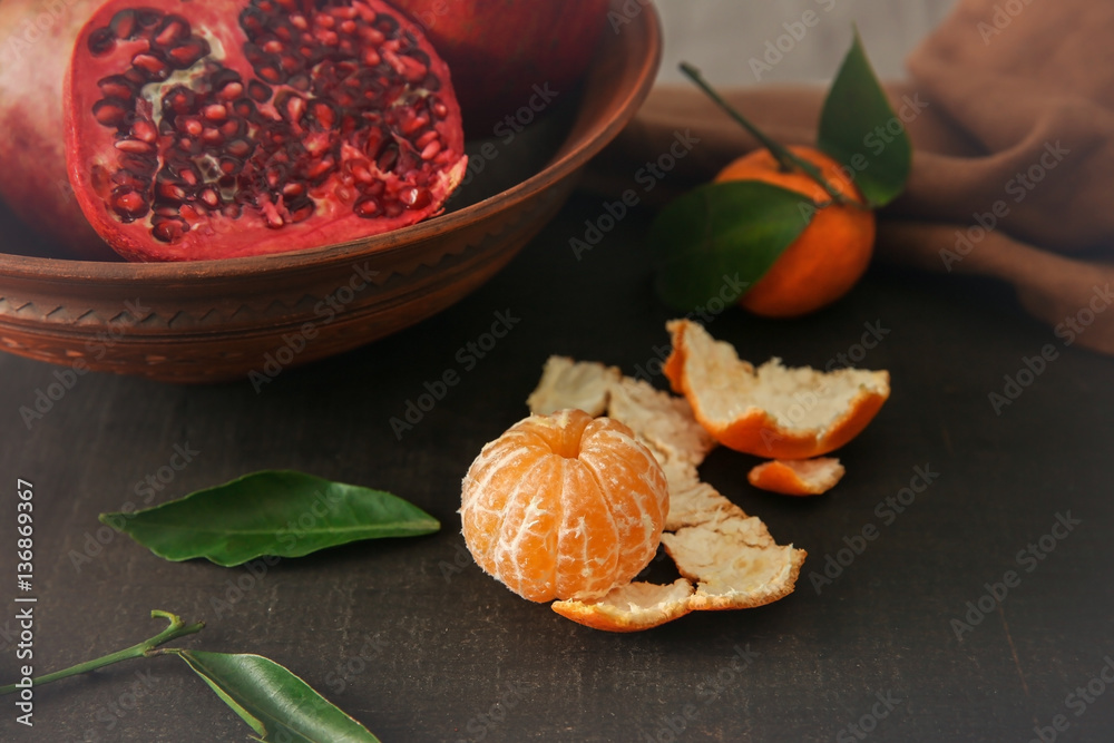 Peeled tangerine on wooden table