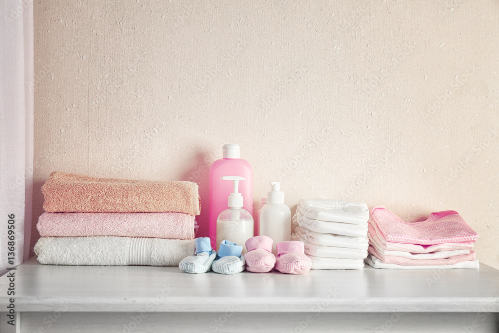 Baby necessities on white chest of drawers