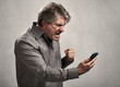 © grinny - Angry Man with cellphone