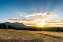 Idyllic Grampians Sunset. Sunset At Grampians National Park Australia. Dry Yellow Grass In The Foreground, Eucalyptus Forest And Iconic Mountain In The Background.