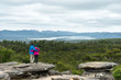 Couple looking at Stunning Grampians National Park View. Older couple standing arm in arm looking at eucalyptus forest and distant lake.