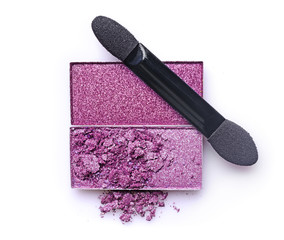 Purple crashed eyeshadow with brush for makeup as sample of cosmetic product