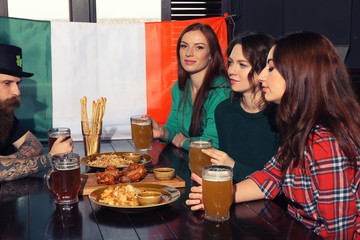 Wall Mural - People celebrating Saint Patrick's Day in pub