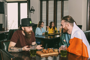 Wall Mural - Men celebrating Saint Patrick's Day in pub